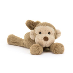 Peluche petit singe allongé...